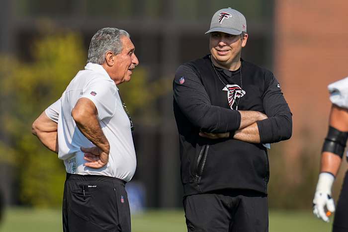 Jul 29, 2021; Flowery Branch, GA, USA; Atlanta Falcons team owner Arthur Blank (left) talks with head coach Arthur Smith on the field during the first day of training camp at the Atlanta Falcons Training Facility.